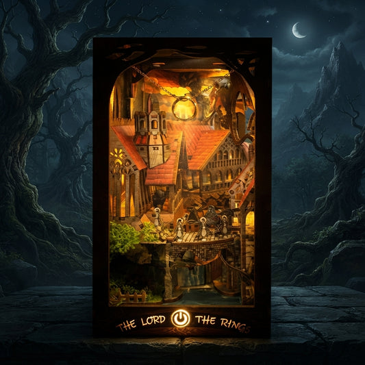 Book Nook Seigneur des Anneaux illuminé la nuit, éclairage LED doré sous un ciel étoilé et une lune