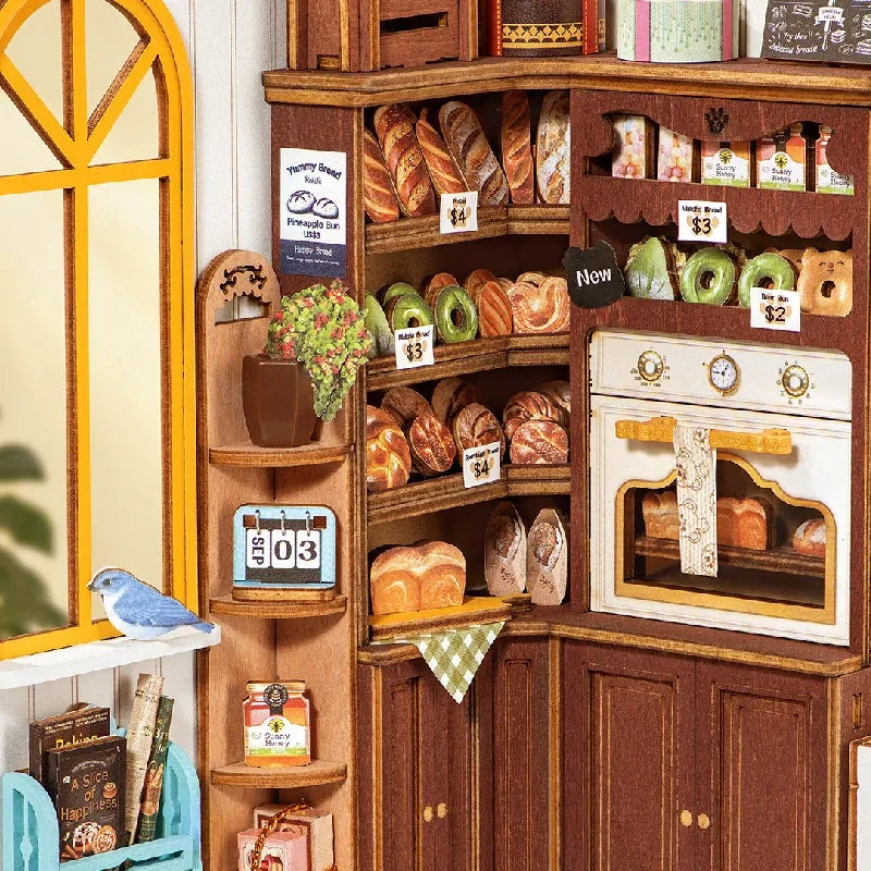 Gros plan sur le coin four, pains et donuts de la boulangerie miniature