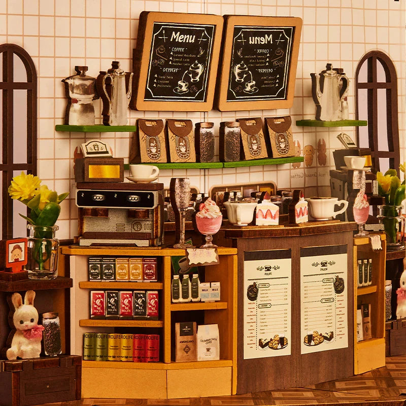 Menus à la craie et mur carrelé derrière le comptoir du book nook Holiday Café