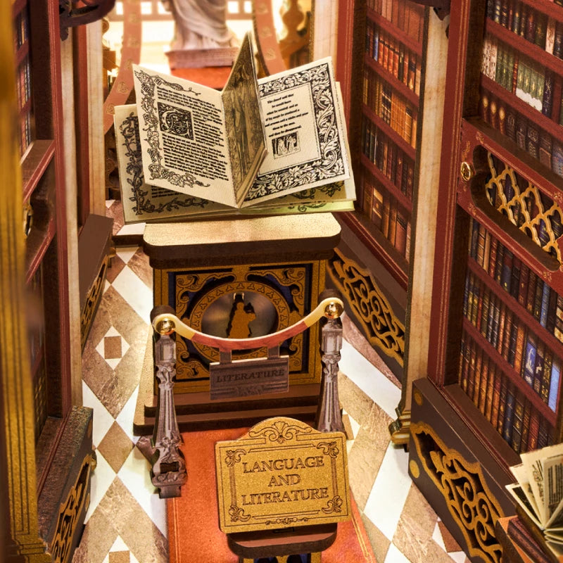 Lutrin avec grand livre ouvert et cordons rouges dans le book nook