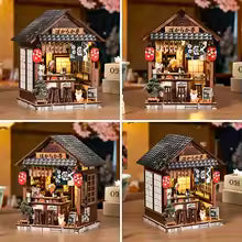 Maison miniature japonaise Taverne Bokaraka, planche de quatre vues sous plusieurs angles avec cerisiers en fleurs, éclairage LED chaleureux, décoration Nook-It.