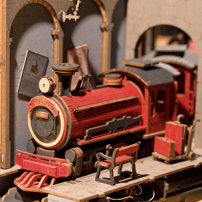Locomotive à vapeur rouge et banc du quai dans le book nook Time Travel