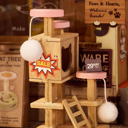 Détail de l'arbre à chat en bois de la maison miniature Fluffy Pets avec pompons