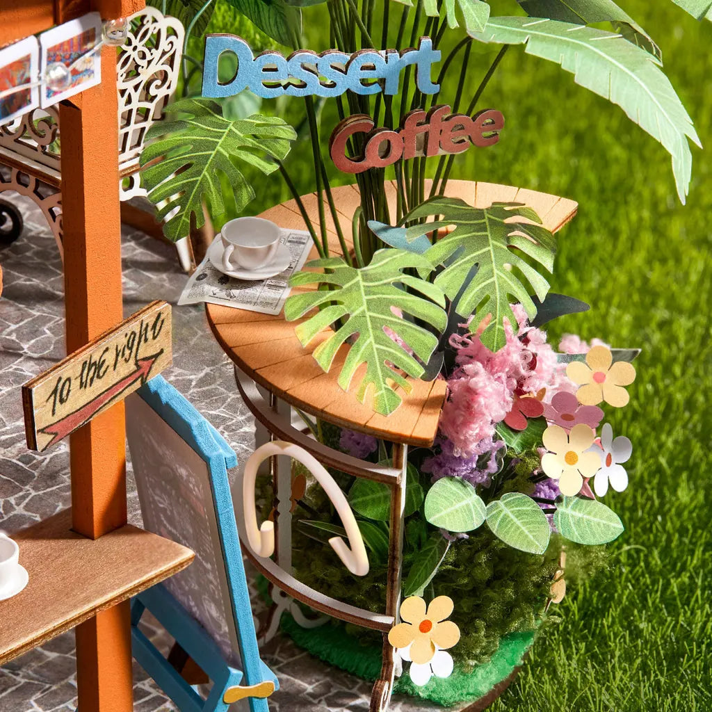 Gros plan sur la table en demi-lune et le panneau Dessert Coffee