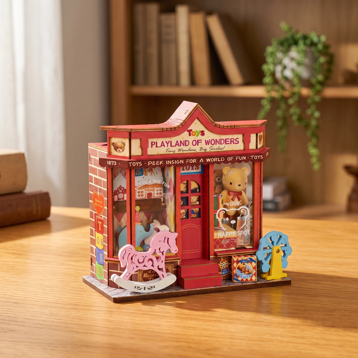 Boutique de jouets miniature Whimsy Toy Shop vue de trois quarts, mur de briques et cubes TOYS