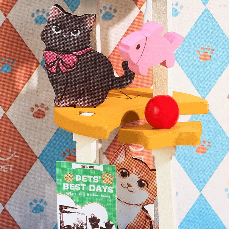 Arbre à chat et affiche Best Days dans l'animalerie Pawfect Pet Shop, gros plan