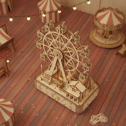 Vue plongeante du puzzle 3D Grande Roue Musicale en bois et son décor de foire