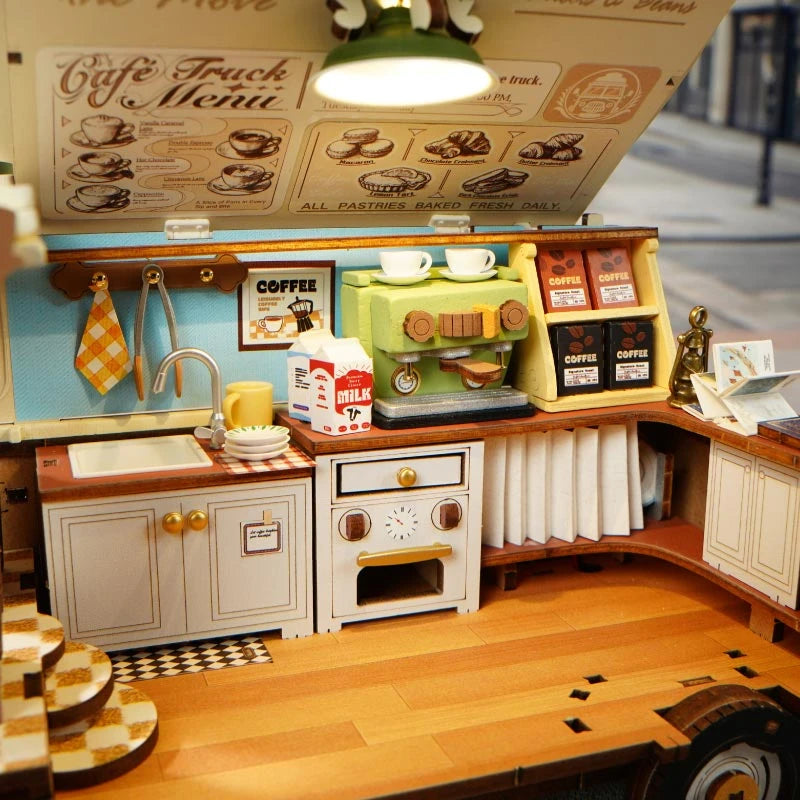 Intérieur du Leo's Coffee Truck, cuisine avec évier, four blanc et machine à expresso