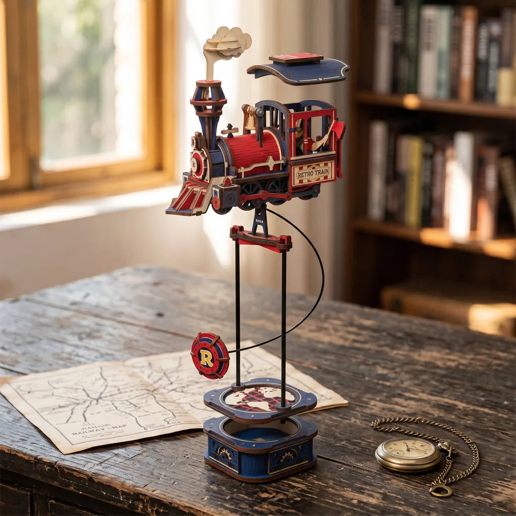 Vue éclatée du Power Express, toit, locomotive et plateau mappemonde séparés au-dessus du socle