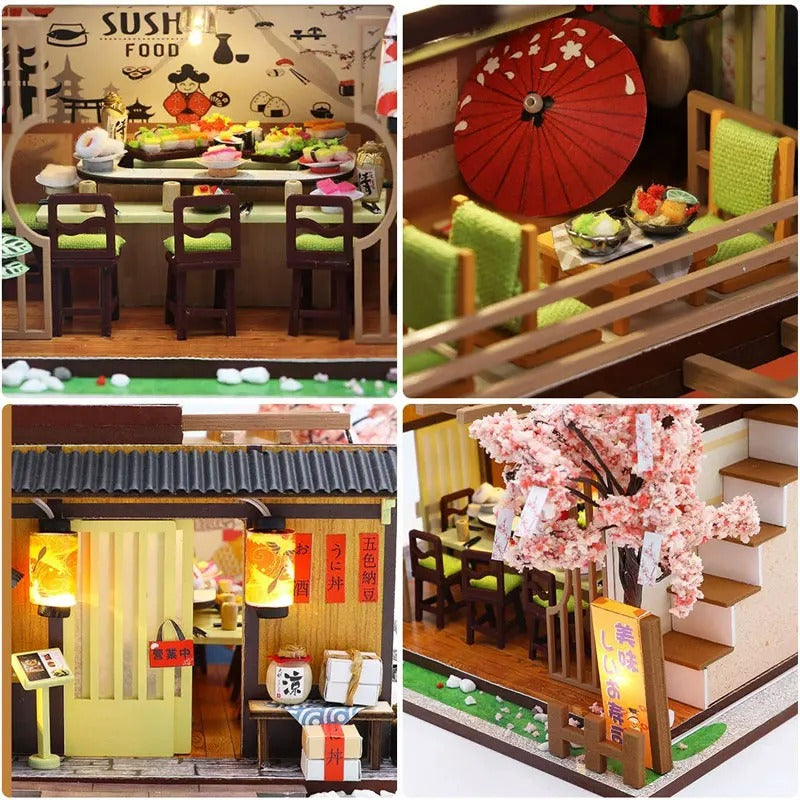 Details du Restaurant Gibbon Sushi miniature : comptoir a sushi, ombrelle rouge, lanternes et cerisier en fleurs