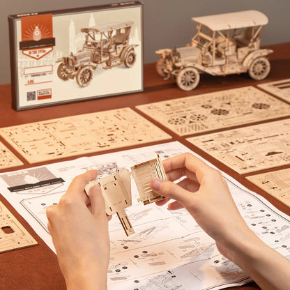 Montage du puzzle 3D Le Roadster Rétro avec la notice, les planches de pièces et le coffret
